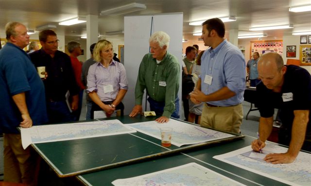 Statoil's Project Manager Kristen Aamodt, flanked by State Rep. Bruce MacDonald on her right and George Friant and Larry Knapp, left, listens as Tetra Tech biologist Aaron Schneider describes the environmental studies that Tetra Tech is conducting at the proposed wind farm site. Linekin Bay Resort's Mark Osbourne takes notes to Schneider's right. SUE MELLO/Boothbay Register Statoil's Project Manager Kristen Aamodt, flanked by State Rep. Bruce MacDonald on her right and George Friant and Larry Knapp, left, listens as Tetra Tech biologist Aaron Schneider describes the environmental studies that Tetra Tech is conducting at the proposed wind farm site. Linekin Bay Resort's Mark Osbourne takes notes to Schneider's right. SUE MELLO/Boothbay Register