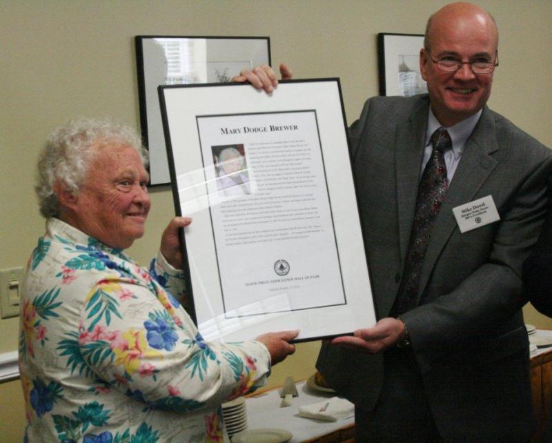 Mary Brewer receives the plaque honoring her as a 2012 inductee into the Maine Press Association's Hall of Fame from Mike Dowd, president of the MPA, at the ceremony held at the Hilton Garden Inn in Freeport October 13. Wiscasset reporter Susan Johns, below, took first place in the News Story category for her article, “Edgecomb board steps out of fireworks store's way,” and third place for her News Story “Alna, Wiscasset residents, officials take stand against dumping.” Wiscasset reporter John Maguire took first place for his Arts & Lifestyle Feature, “My, how I have grown,” a first “tree” story written from the perspective of the giant tree behind Red's Eats. SARAH MORLEY/Boothbay Register Mary Brewer receives the plaque honoring her as a 2012 inductee into the Maine Press Association's Hall of Fame from Mike Dowd, president of the MPA, at the ceremony held at the Hilton Garden Inn in Freeport October 13. SARAH MORLEY/Boothbay Register