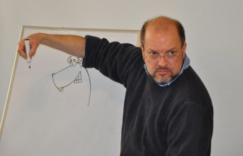 Below: Jeff Pert puts the finishing touches on a cartoon moose Saturday at the Boothbay Harbor Memorial Library. BEN BULKELEY/Boothbay Register Below: Jeff Pert puts the finishing touches on a cartoon moose Saturday at the Boothbay Harbor Memorial Library. BEN BULKELEY/Boothbay Register
