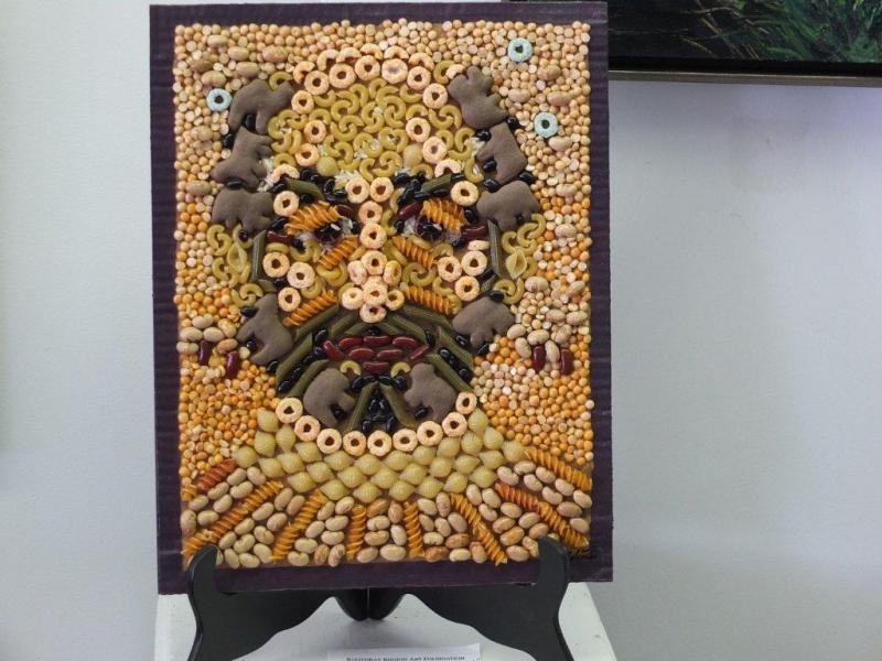 "Jim Taliana," a self portrait in pasta and crackers. Below: Whale Park off Commercial Street in Boothbay Harbor is the site of a proposed park bench to celebrate the life of Jim Taliana, who was known throughout town for his love for art and community service. A bicycle rack marks the spot where the stone bench is to be placed. Courtesy Barbara Eldred "Jim Taliana," a self portrait in pasta and crackers.
