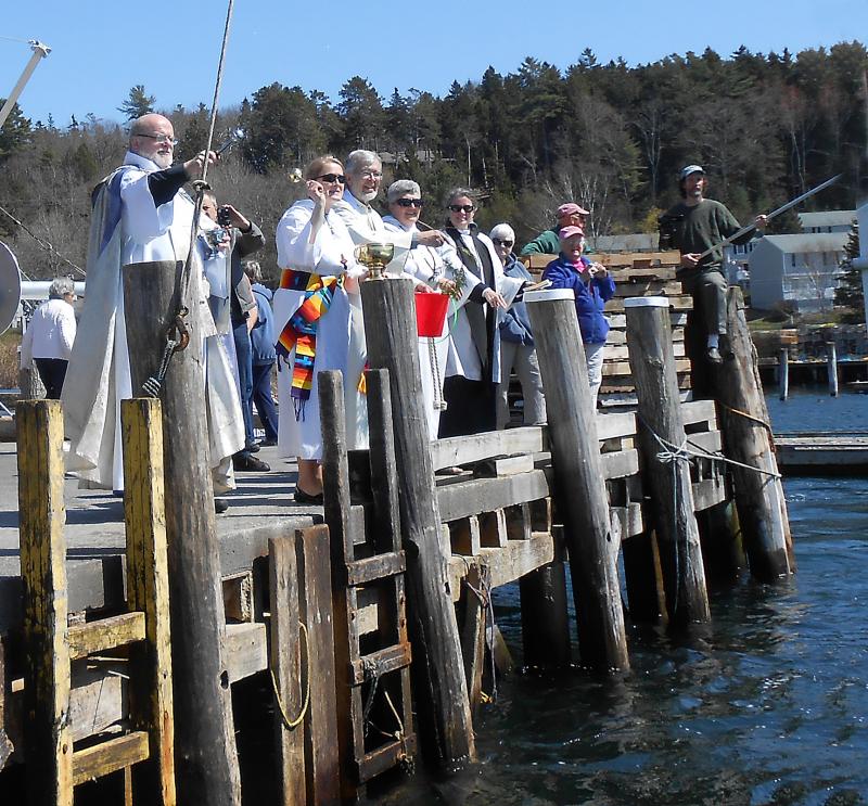 Area clergy bless lobsterman Clive Farrin's boat, the "Sea Swallow, as she passes by. The blessing is performed following the outside memorial service held at the Fishermen's Memorial on Atlantic Avenue to honor those lost at sea. GARY DOW/Boothbay Register Area clergy bless lobsterman Clive Farrin's boat, the "Sea Swallow, as she passes by. The blessing is performed following the outside memorial service held at the Fishermen's Memorial on Atlantic Avenue to honor those lost at sea. GARY DOW/Boothbay Register