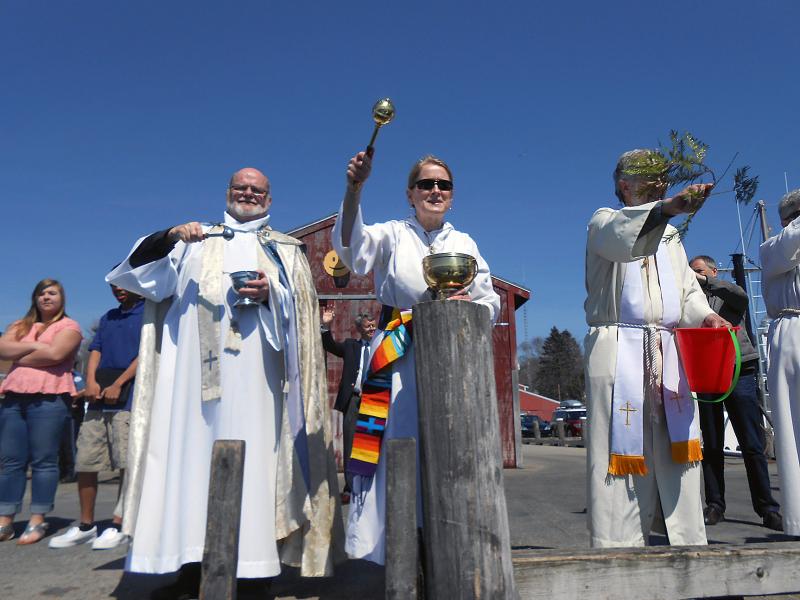 Father Fred Morse and Rev. Sarah Foulger bless lobsterman Clive Farrin's boat, the "Sea Swallow, as she passes by. The blessing is performed following the outside memorial service held at the Fishermen's Memorial on Atlantic Avenue to honor those lost at sea. GARY DOW/Boothbay Register Father Fred Morse and Rev. Sarah Foulger bless lobsterman Clive Farrin's boat, the "Sea Swallow, as she passes by. The blessing is performed following the outside memorial service held at the Fishermen's Memorial on Atlantic Avenue to honor those lost at sea. GARY DOW/Boothbay Register