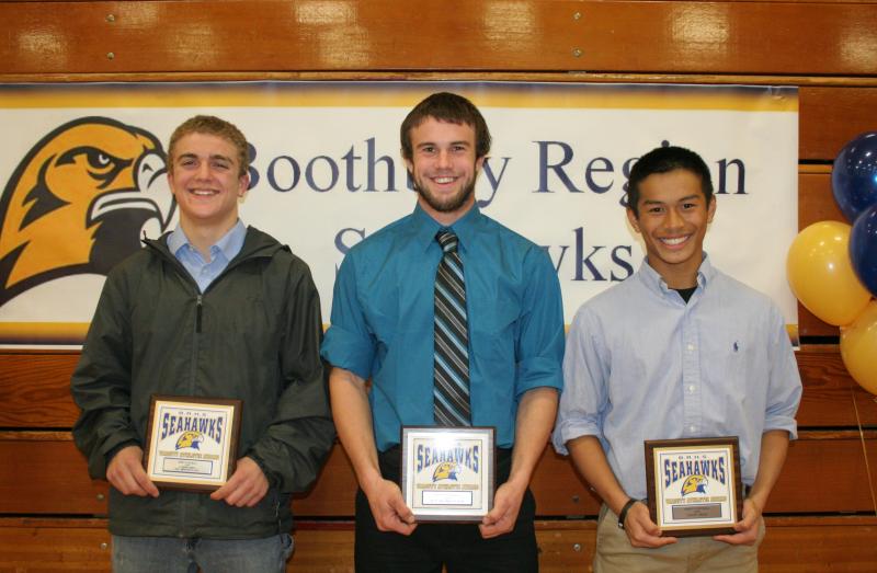 Football plaque winners, from left, Zach Vise, Most Improved; Jason Maddocks, Most Valuable; and Jude Alamo, Coaches Award. Maddocks later gave his plaque to teammate Thomas Cornell. KEVIN BURNHAM/Boothbay Register Football plaque winners, from left, Zach Vise, Most Improved; Jason Maddocks, Most Valuable; and Jude Alamo, Coaches Award. Maddocks later gave his plaque to teammate Thomas Cornell. KEVIN BURNHAM/Boothbay Register