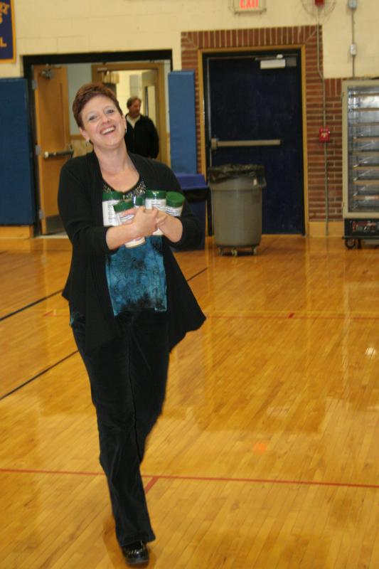Booster Club president Heather O’Brien brings a load of Parmesan cheese to the banquet table. KEVIN BURNHAM/Boothbay Register Booster Club president Heather O’Brien brings a load of Parmesan cheese to the banquet table. KEVIN BURNHAM/Boothbay Register