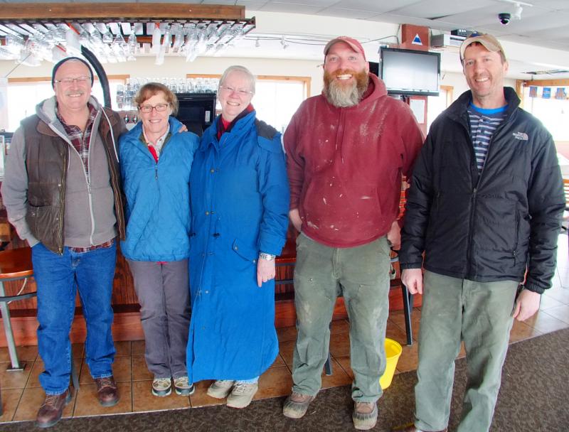 JON AND DEB HODGDON, left, will be looking for guidance from former Knot Gray’s Wharf owners, Pat Carmolli, Korey Lewis and Carmolli’s son, Rick Carmolli. SUZI THAYER/Boothbay Register