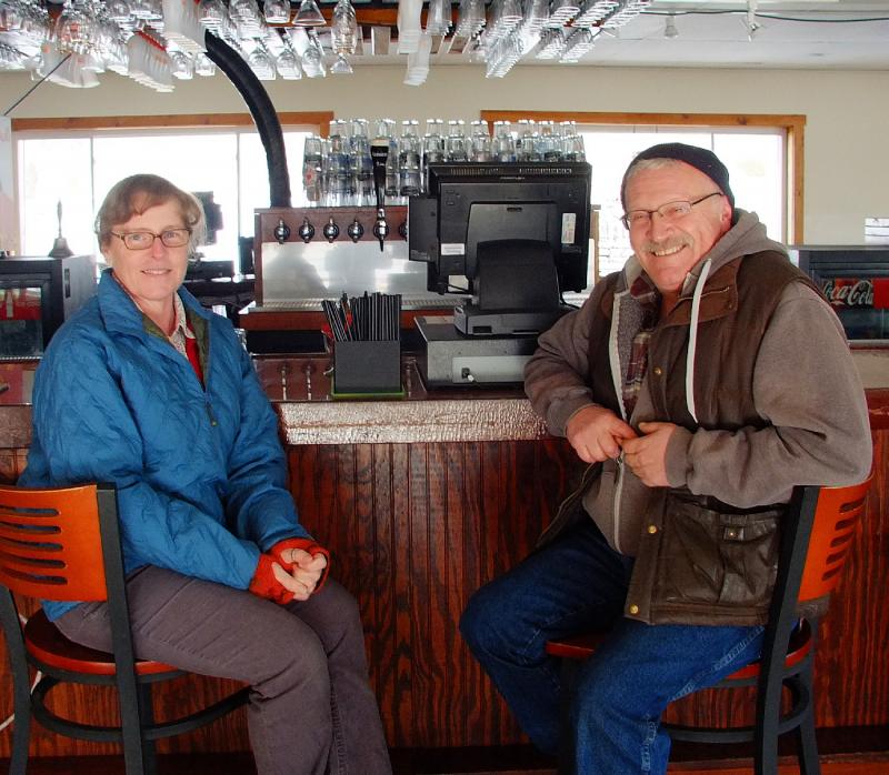 DEB AND JON HODGDON sit at the bar of their new restaurant, Herringbone’s Pub & Grill. SUZI THAYER/Boothbay Register