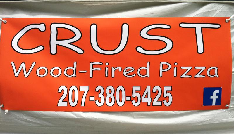 CRUST’S NEW BANNER, on the side of a white tent, on Route 27 across from Hammond Lumber. SUZI THAYER/Boothbay Register