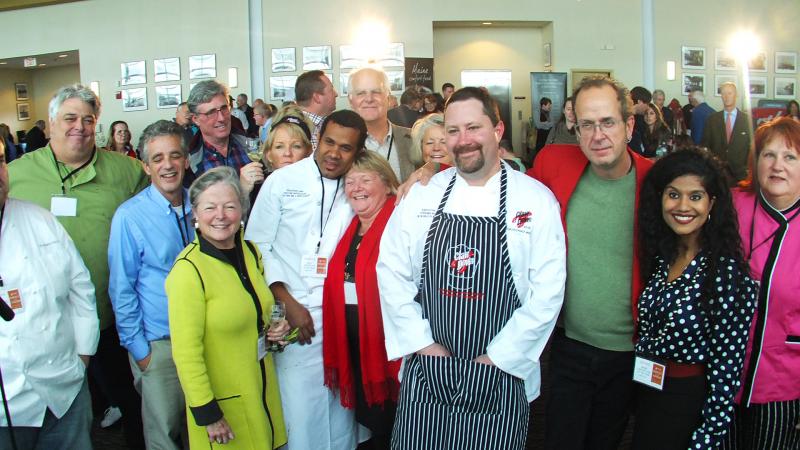 This happy group was at the Maine Lobster Chef of the Year event in Portland on Friday, Oct. 24, representing Boothbay Harbor’s three competing chefs, winner Steve Richards, center, Dwayne Whitelocke, fourth from left, and Margaret Salt McLellan, right. Cherie Scott, from the Boothbay Harbor Region Chamber of Commerce, next to McLellan, played a huge part in helping and cheering on the competitors. SUZI THAYER/Boothbay Register