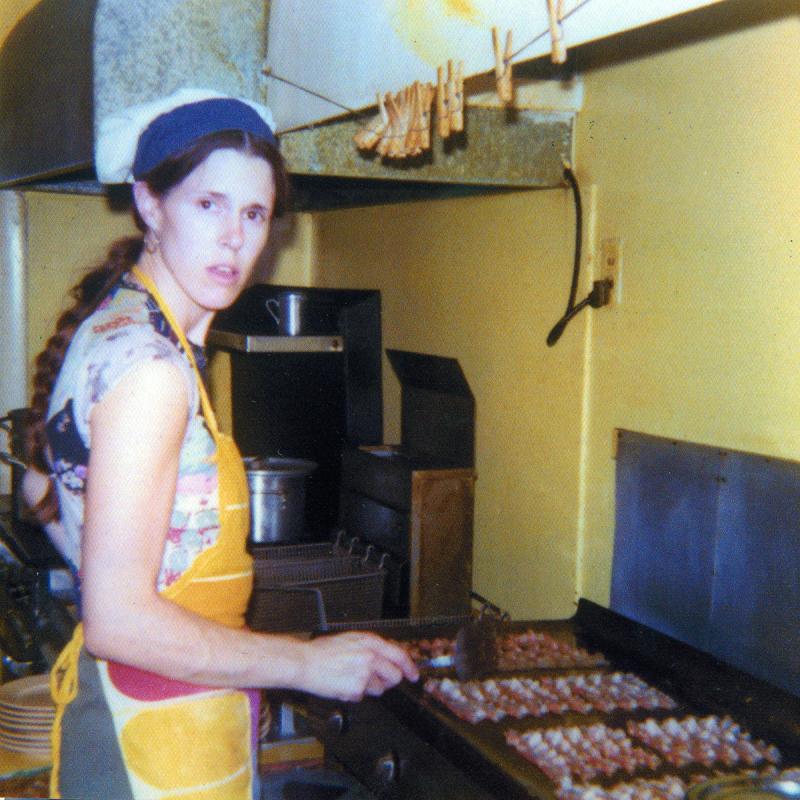 Nancy Gilchrist frying bacon for breakfast at the Ebb Tide in 1975. Courtesy of Peter Gilchrist