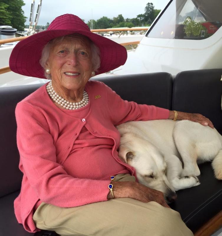 Former first lady Barbara Bush snuggled with Deborah Mellen’s dog, Winter, during a sail off Kennebunkport on Aug. 24. Courtesy of Harry Horgan