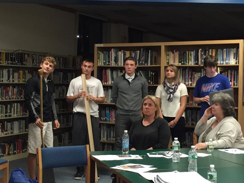Members of the “Making and Marketing” class at BRHS present their company, dubbed the “Boothbay Paddle Company” to the CSD School Committee on Nov. 4. From left are Joe Paolillo (design and engineering), Nick McCullough (quality control), Camden Spear (marketing), Anna Baumm (marketing), and Nick Gorey (finance). Sitting are committee members Stephanie Hawke and Sandy Paxson. KATRINA CLARK/Boothbay Register