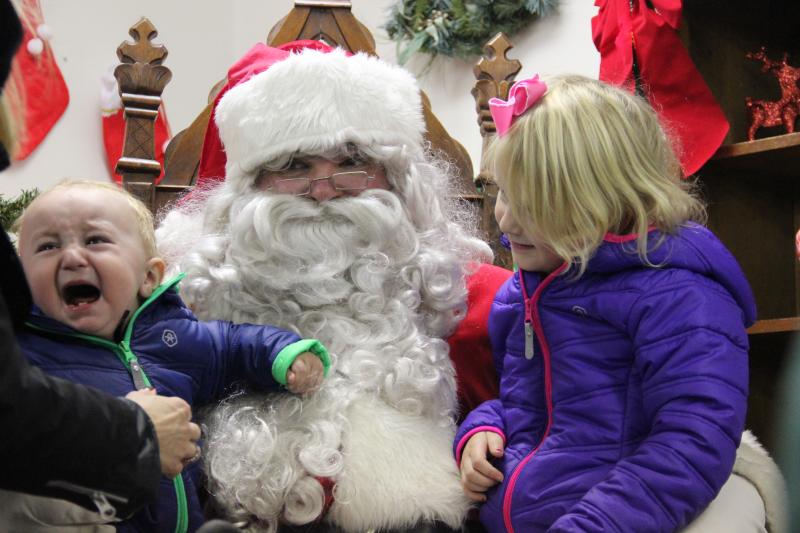 Not enough lap for two. DIANE DORBIN/Boothbay Register Santa Boothbay