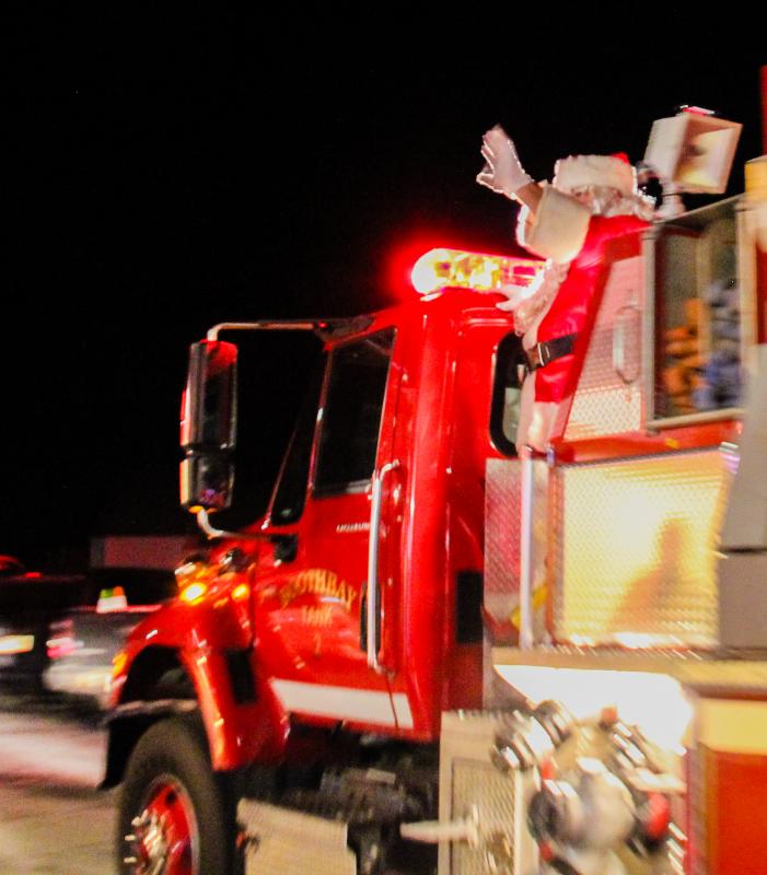Santa arrives on Boothbay Engine No. 2 DIANE DORBIN/Boothbay Register Santa Engine No. 2