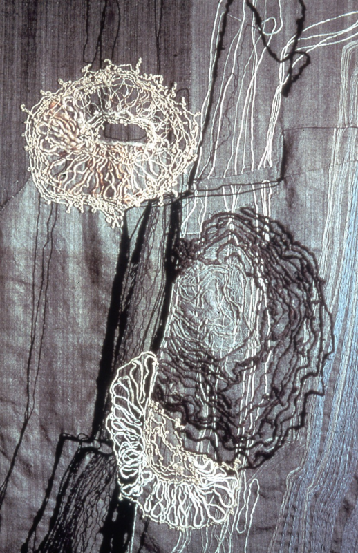 Closeup of “Rock Lichen” - 1975 – 68” high x 50” wide. The fabric is of lamb’s wool, twill weave; surface embroidery in lamb’s wool, mohair and karakul in stem, satin, chain, running and closed buttonhole stitches; hidden couching; folded and pieces; fringed; backed with cotton, plain weave, with double warps in stripes. Signed. Courtesy of the Barton family Nancy Hemenway Barton