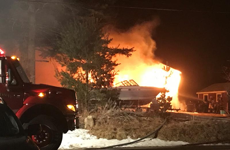 Firefighters battle the fire at 12 Matthews Road on Tuesday morning. Courtesy of Emily Mirabile