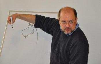Below: Jeff Pert puts the finishing touches on a cartoon moose Saturday at the Boothbay Harbor Memorial Library. BEN BULKELEY/Boothbay Register Below: Jeff Pert puts the finishing touches on a cartoon moose Saturday at the Boothbay Harbor Memorial Library. BEN BULKELEY/Boothbay Register