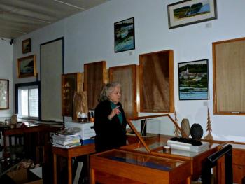 Susan Foss packs up jewelry from one of the many cases in A Silver Lining. KATRINA CLARK/Boothbay Register