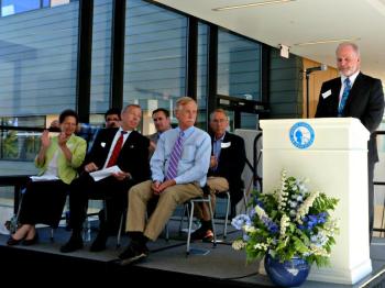 Dr. Graham Shimmield welcomes the audience. Counter-clockwise from left front, Mary Bigelow, Robert Healing, Sen. Angus King, David Coit, Jim Chaousis and Alex Vermont. KATRINA CLARK/Boothbay Register