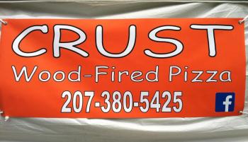 CRUST’S NEW BANNER, on the side of a white tent, on Route 27 across from Hammond Lumber. SUZI THAYER/Boothbay Register