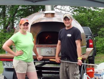 KATIE McLELLAN and Eric Cornell stand next to their copper wood-fired oven. SUZI THAYER/Boothbay Register