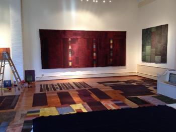 George Mason’s studio in Nobleboro. “Aubergine” hangs in the center with “To Mend 3” on the wall to the right. The first “To Mend,” also 77 by 84-inch is included in the recent exhibition at The Holocaust and Human Rights Center, “The Dilemma of Memory.” George Mason ME studio