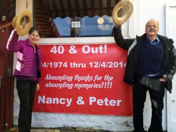 Nancy and Peter Gilchrist stand in front of their restaurant, Ebb Tide, of 40 years. They will retire Dec. 4. SUZI THAYER/Boothbay Register