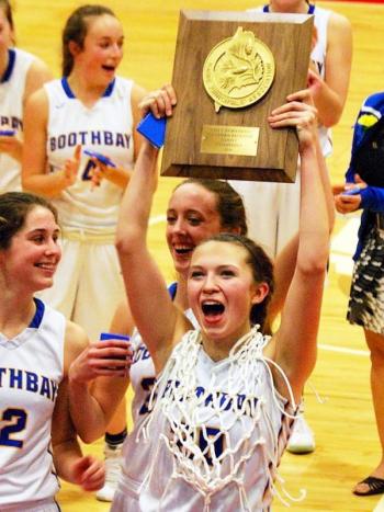 Hannah Morley holds up the plaque after winning the Class C South regional final game at the Civic Center on Feb. 20. Courtesy of Sarah Morley