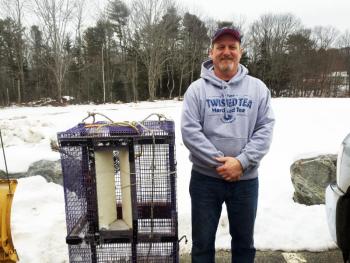 Tim Simmons with one of his shrimp traps, at his Boothbay store, T&D Variety. SUZI THAYER/Boothbay Register