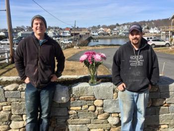 Joe Norton, left, and Willie Morton stand in front of the stone wall they built at Margaret and Steve Branch’s home, at the east end of the footbridge in Boothbay Harbor. SUZI THAYER/Boothbay Register Joe Norton and Willie Morton