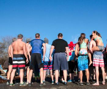 The huddle before the plunge. DIANE DORBIN/Boothbay Register Penguin Plunge