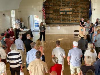 Boothbay Register's Sarah Morley speaks to the Business After Hours crowd at the Boothbay Railway Village Museum Aug. 6. FRITZ FREUDENBERGER/Boothbay Register Boothbay Register's Sarah Morley speaks to the Business After Hours crowd at the Boothbay Railway Village Museum Aug. 6. FRITZ FREUDENBERGER/Boothbay Register