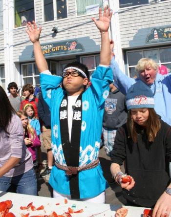 Daisuke Miyagawa celebrates after downing his second lobster. BEN BULKELEY/Boothbay Register