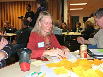 Danielle Betts of East Boothbay writes “the night sky” on a sticky note as a thing of value in our region. KATRINA CLARK/Boothbay Register