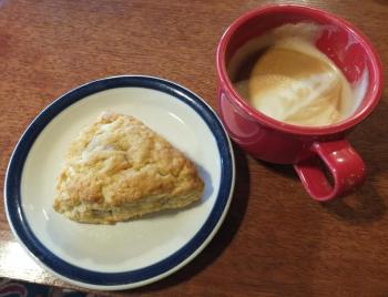 A scone and a latte served in a red cup at Red Cup Coffeehouse. SUZI THAYER/Boothbay Register