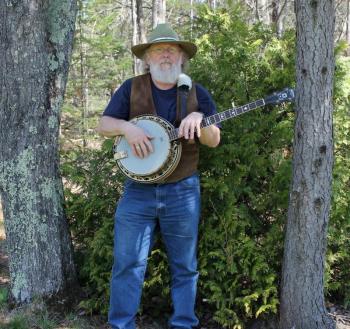 Musician Jeff Herbster plays several types of banjo.