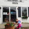 8-year-old Sofia Stenberg admires the flowers that she and Jen Auber planted in the new whiskey barrels in front of the Southport post office last week. The Southport Island Association donated the flowers and barrels. Courtesy of Jen Auber 