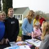Kristy Anderson, far left, fills in for event organizer Sarah Blackman, who couldn’t attend because she was injured on Saturday. Next to Anderson is Blackman’s daughter, Victoria. Also helping is Kyra, right. NICOLE LYONS/Boothbay Register