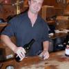 Jason Holloway of Andrews’ Harborside was quite busy serving  Barefoot Winery wines all evening. GARY DOW/Boothbay Register