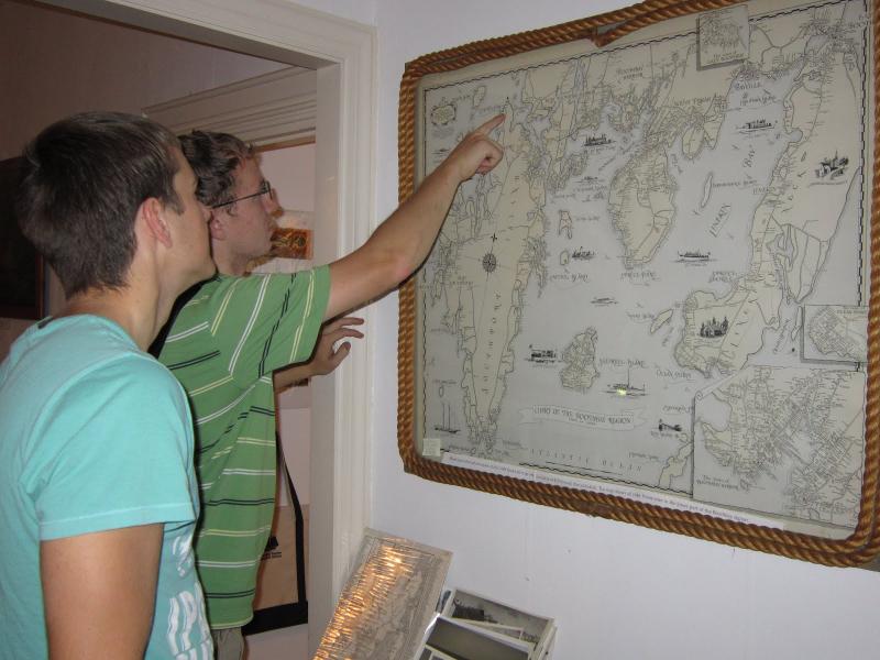 Lupieka, foreground, and Joshua Edwards look at a historic map of the Boothbay region at the Balmy Days Museum. Lupieka, foreground, and Joshua Edwards look at a historic map of the Boothbay region at the Balmy Days Museum.