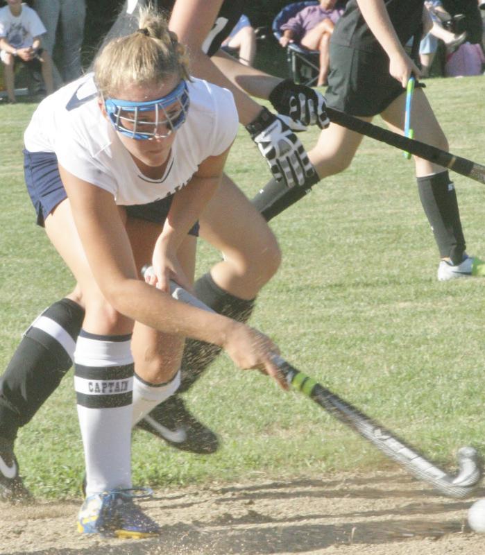 Senior Co-Captain Sarah Caron keeps her eyes on the ball as she tries to pass to a teammate during Wednesday's home and season opener against St. Dom's. Below, Tori Schmid, a junior on the Lady Seahawks field hockey team, dribbles the ball up-field. KEVIN BURNHAM/Boothbay Register Senior Co-Captain Sarah Caron keeps her eyes on the ball as she tries to pass to a teammate during Wednesday's home and season opener against St. Dom's. KEVIN BURNHAM/Boothbay Register