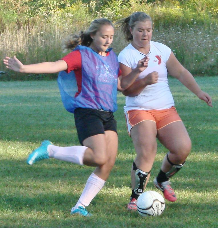 Anna Baumm (left) and Brenna Alley vie for the ball during a scrimmage at the August 30 team practice. LISA KRISTOFF/Boothbay Register Anna Baumm (left) and Brenna Alley vie for the ball during a scrimmage at the August 30 team practice. LISA KRISTOFF/Boothbay Register