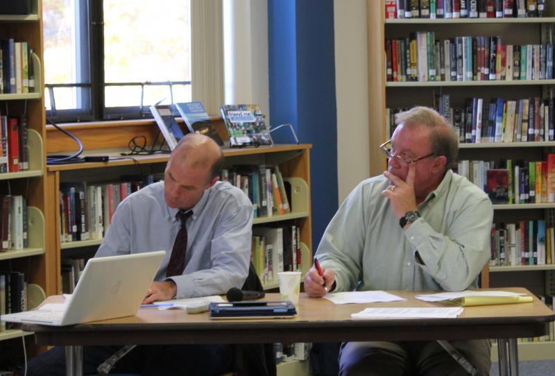 Mark Gorey, left, and Rotarian Bill Bailey listen and take notes during a student presentation. SUE MELLO/Boothbay Register Mark Gorey, left, and Rotarian Bill Bailey listen and take notes during a student presentation. SUE MELLO/Boothbay Register