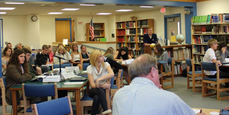 Debaters and the audience, including Principal Dan Welch, listen intently to opening remarks on October 26. SUE MELLO/Boothbay Register Debaters and the audience, including Principal Dan Welch, listen intently to opening remarks on October 26. SUE MELLO/Boothbay Register