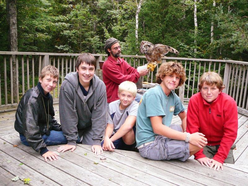 Troop 238 visited Birdsacre Sanctuary in Ellsworth. Pictured from left are, front: Parker Elkins; Jacob Bishopp; Draco Peaslee; Sherman Brewer; Jake Brewer; back: birdhandler Grayson with a resident owl. Below, Jacob Bishopp learns how to hold a wood duck on his birthday. Courtesy of Sarah Sherman Troop 238 visited Birdsacre Sanctuary in Ellsworth. Pictured from left are, front: Parker Elkins; Jacob Bishopp; Draco Peaslee; Sherman Brewer; Jake Brewer; back: birdhandler Grayson with a resident owl. Courtesy of Sarah Sherman