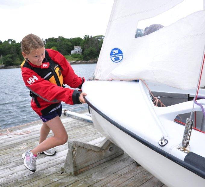 Madison Gaudette pushes in her 420 with the help of her skipper Jessica Murphy (not pictured). The Boothbay Harbor Yacht Club's Andy Holmes and Boothbay Region High School Club Sailing Team Head Coach Sally Lloyd said they would like to see the club affiliated with the high school. BEN BULKELEY/Boothbay Register Madison Gaudette pushes in her 420 with the help of her skipper Jessica Murphy (not pictured). The Boothbay Harbor Yacht Club's Andy Holmes and Boothbay Region High School Club Sailing Team Head Coach Sally Lloyd said they would like to see the club affiliated with the high school. BEN BULKELEY/Boothbay Register