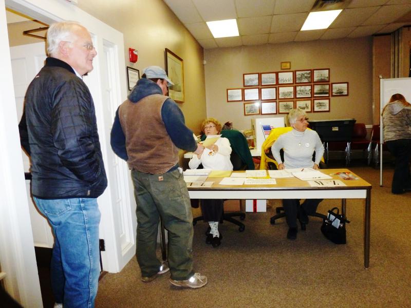 Volunteers hand out ballots. Volunteers hand out ballots.