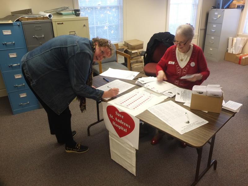 Kerri Kelley signs the St. Andrews petition after voting at the Boothbay Town Office. As of 12:45 p.m., over 771 signatures from four towns have been collected. Kerri Kelley signs the St. Andrews petition after voting at the Boothbay Town Office. As of 12:45 p.m., over 771 signatures from four towns have been collected.