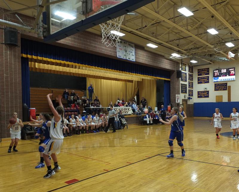 With 0.8 seconds on the clock, senior captain Sarah Caron lines up for a three-point field goal, giving the Lady Seahawks the lead over Madison, 40-35 at the end of the third period. RYAN LEIGHTON/Boothbay Register With 0.8 seconds on the clock, senior captain Sarah Caron lines up for a three-point field goal, giving the Lady Seahawks the lead over Madison, 40-35 at the end of the third period. RYAN LEIGHTON/Boothbay Register