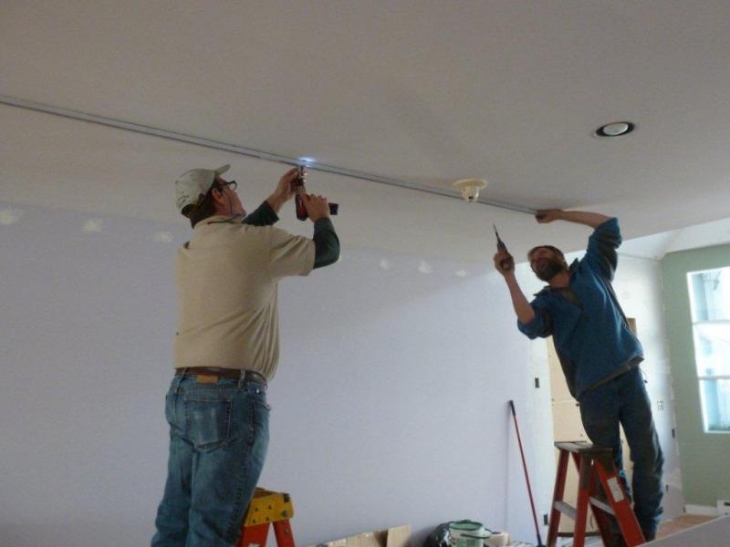 Ron Arsenault, left, and Ted Dowling work to remove the track lighting in Eventide’s expansion. KATRINA CLARK/Boothbay Register Ron Arsenault, left, and Ted Dowling work to remove the track lighting in Eventide’s expansion. KATRINA CLARK/Boothbay Register