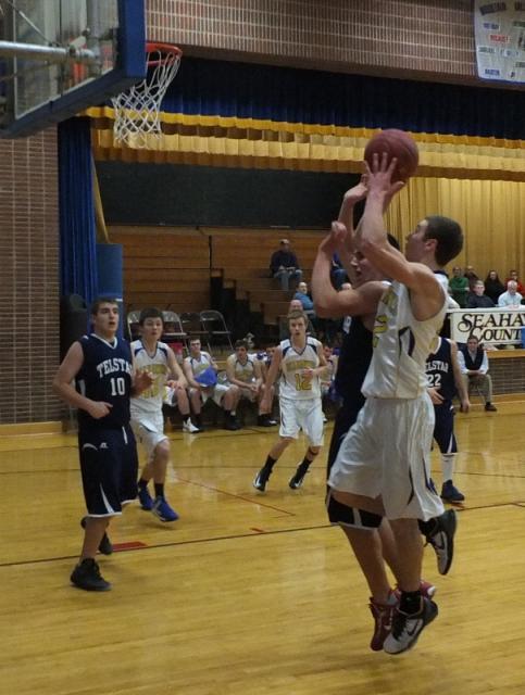 Anthony DiMauro pulls up for a jump shot at home against Telstar January 11. Below: Shawn Simmons drives to the basket. The junior forward scored seven points for Boothbay. RYAN LEIGHTON/Boothbay Register
Anthony DiMauro pulls up for a jump shot at home against Telstar January 11.